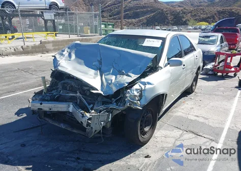 2003 Toyota Camry Le z USA, uszkodzony, nr VIN JTDBE32KX30154150